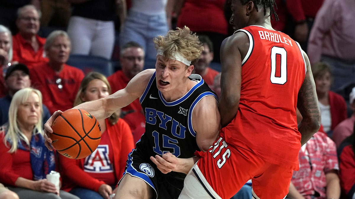 Richie Saunders drives in a basket