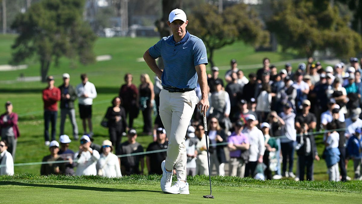 Rory McIlroy stands on green