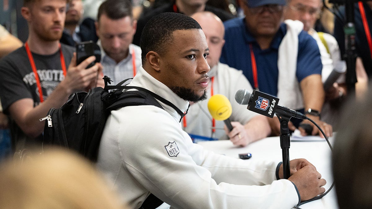 Saquon Barkley looks on