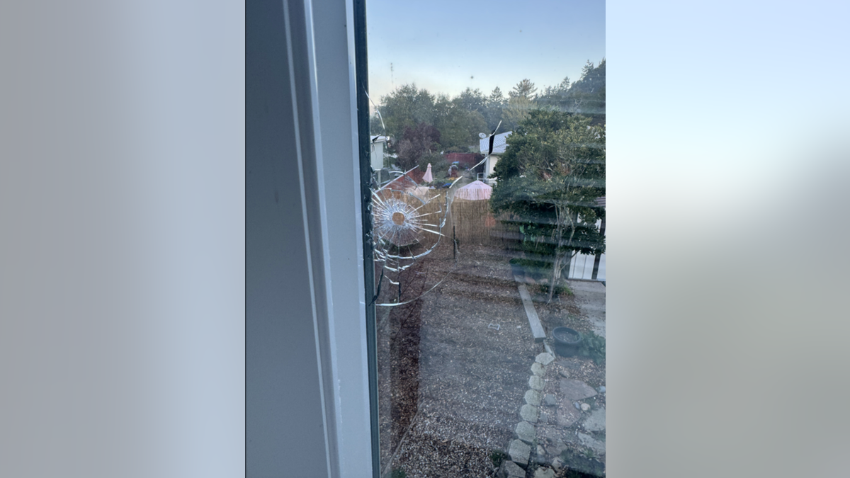 Hole in the window of former San Jose State assistant volleyball coach Melissa Batie-Smoose after an incident where her home was shot at by, what police have determined, was a pellet gun. 