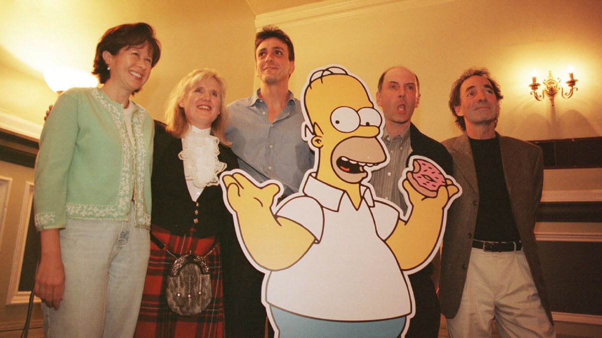 Dan Castellaneta, who is the voice of Homer Simpson, with (L to R) Yeardley Smith, Lisa's voice; Nancy Cartwright, Bart's voice; Hank Azaria, Moe's voice; and Harry Shearer, Mr Burns's voice