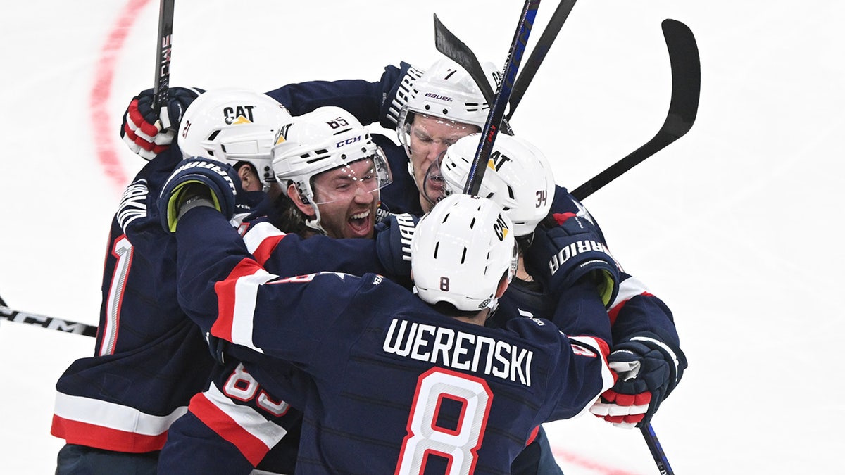 The United States team celebrates the objective