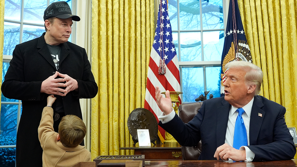 Elon Musk and son left, in the Oval Office; Trump sits on the right