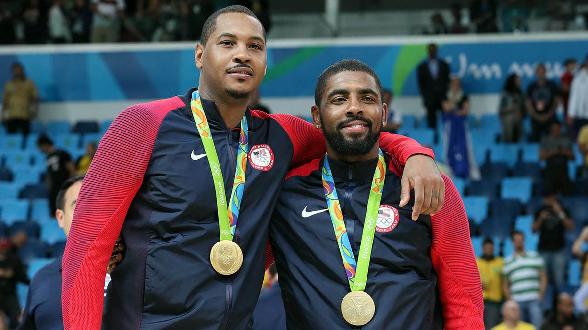 Kyrie Irving and Carmelo Anthony with gold medals