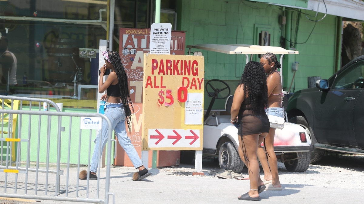 A sign advertises parking for $50 on Saturday, April 20, 2024 during Orange Crush on Tybee Island.