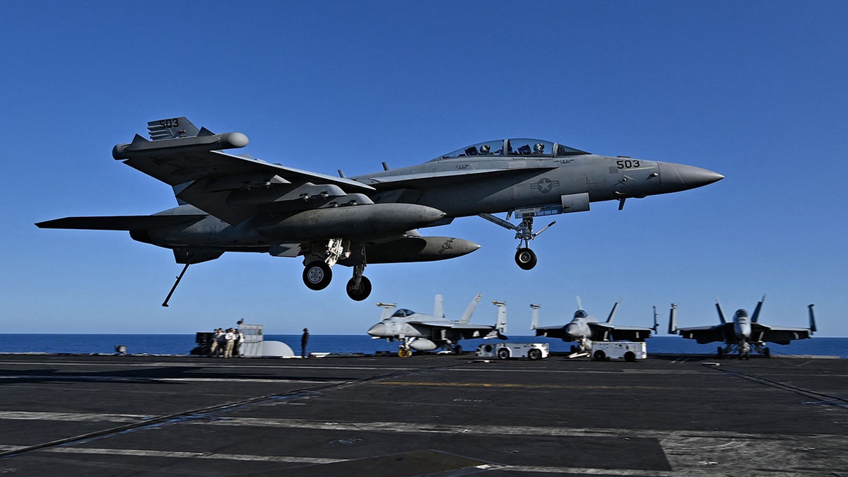 F/A-18 Hornet fighter jet lands on US aircraft carrier