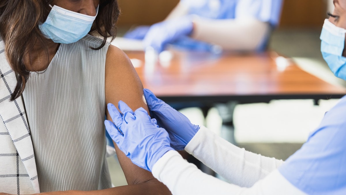 Woman getting vaccine