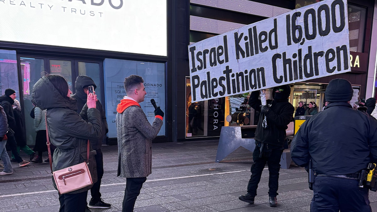 Zach Sage Fox confronts a protester