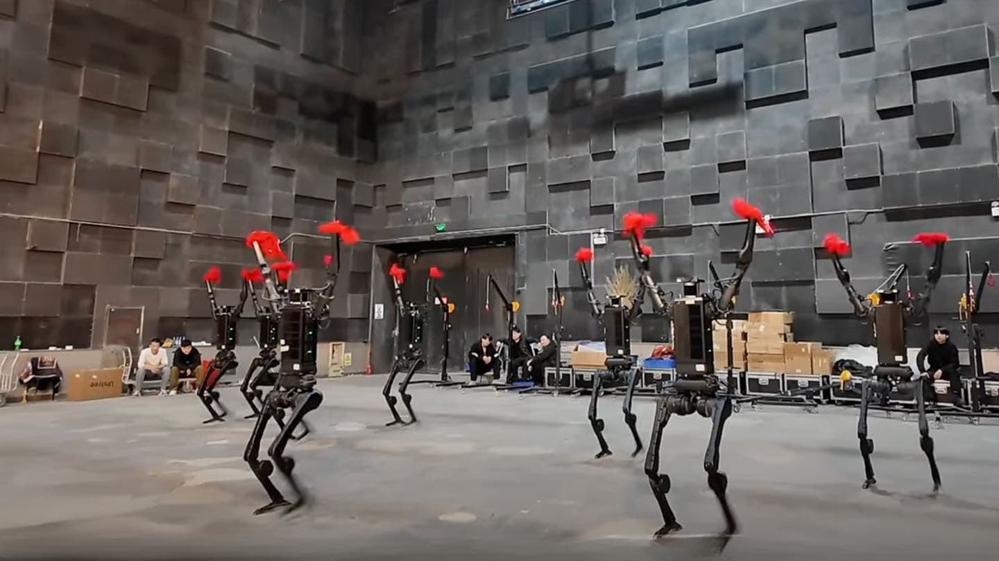 3 humanoid robots bust dance moves alongside humans