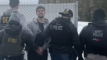 Illegal migrant gang member flashes sinister smile during arrest - Fox News