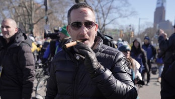 Eagles GM Howie Roseman bleeds from forehead after being hit with beer can during Super Bowl parade