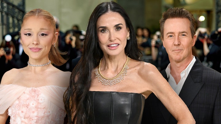 Demi Moore walks the red carpet in a gold dress at the 2025 Golden Globes