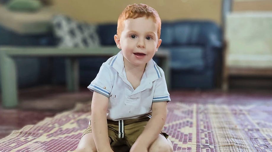 Israeli toddler Ariel Bibas, smiling in family photo