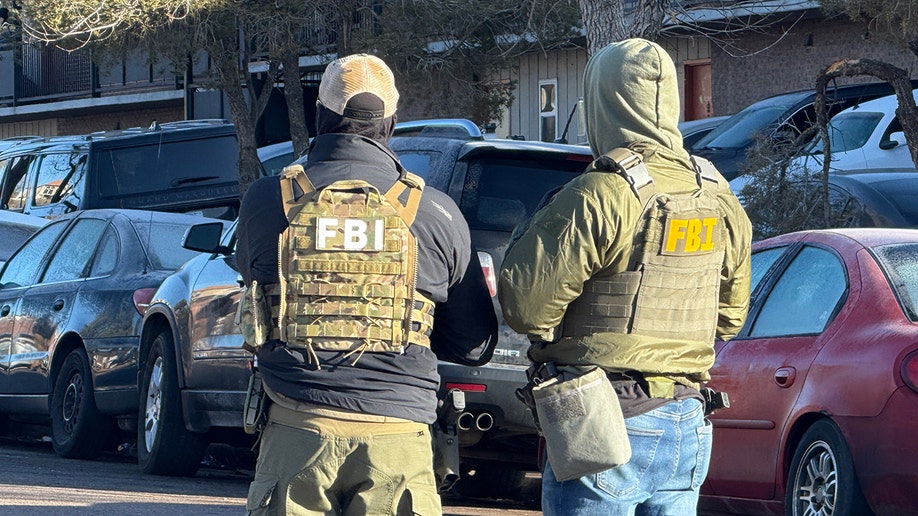 Two FBI agents side-by-side successful  Denver