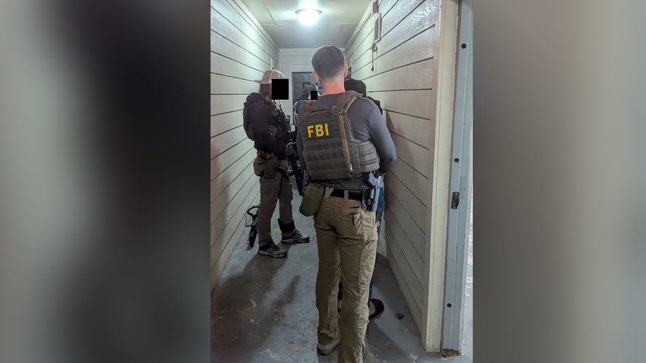 FBI agents arresting pack  members