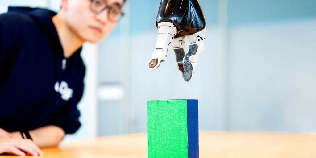 AI enables paralyzed man to control robotic arm with brain signals