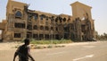 An army soldier walks in front of the Republican Palace in Khartoum, Sudan, after it was taken over by Sudan's army Friday, March 21, 2025. - Fox News