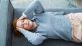 Mid adult woman sitting on safe at home with headache - Fox News