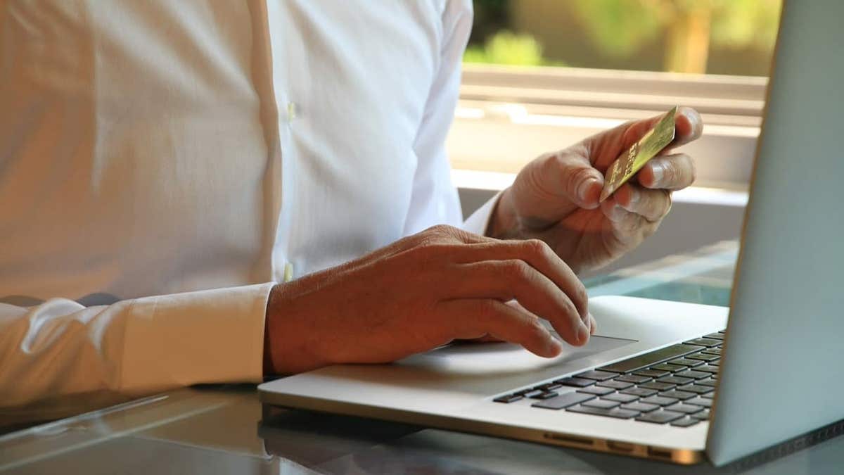 man making online purchase