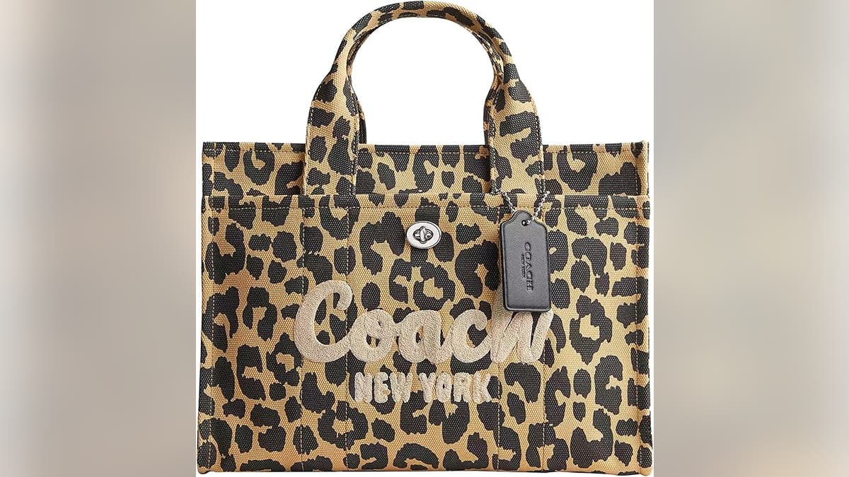The Coach cargo tote features a chic leopard people connected durable canvas and is equipped pinch aggregate pockets to stash each your belongings.