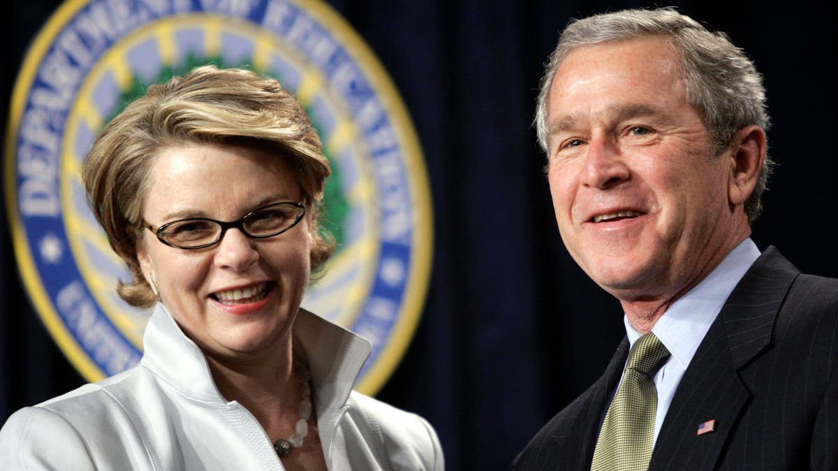 Former President George W. Bush and Margaret Spellings smile during her swearing-in ceremony leading the Department of Education on Jan. 31, 2005.