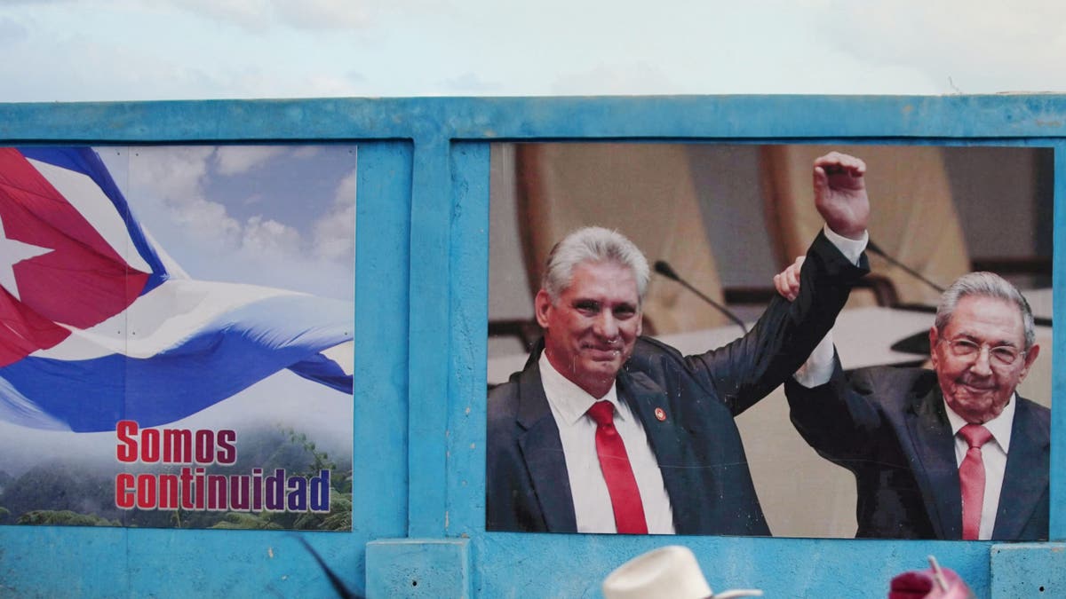 Cuban dictator Miguel Diaz-Canel on a campaign poster with the late Raul Castro. 