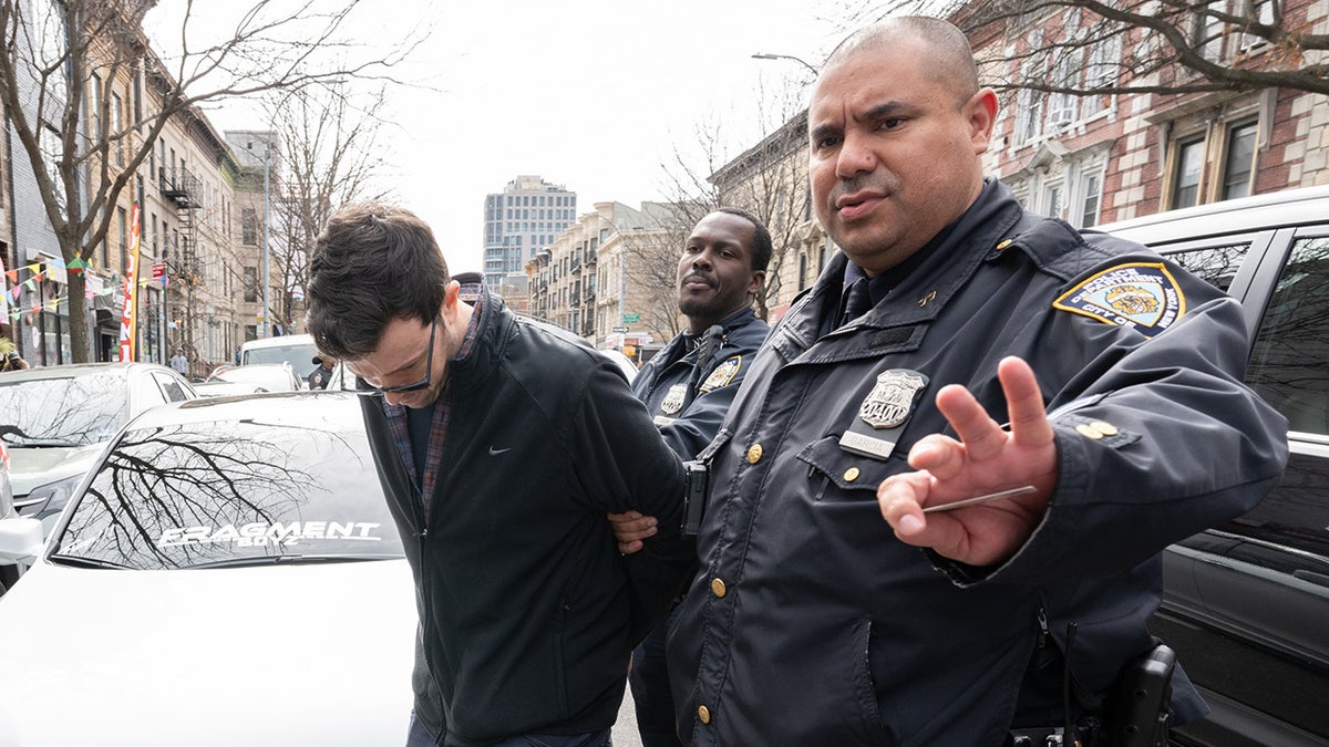 Michael Lewis, 42, was accused of drawing a hate symbol on a New York City Cybertruck.