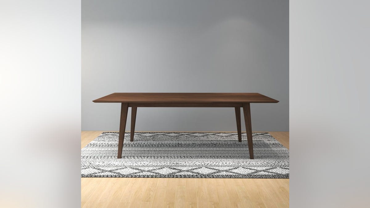 A mid-century style table in a beautiful wood finish.