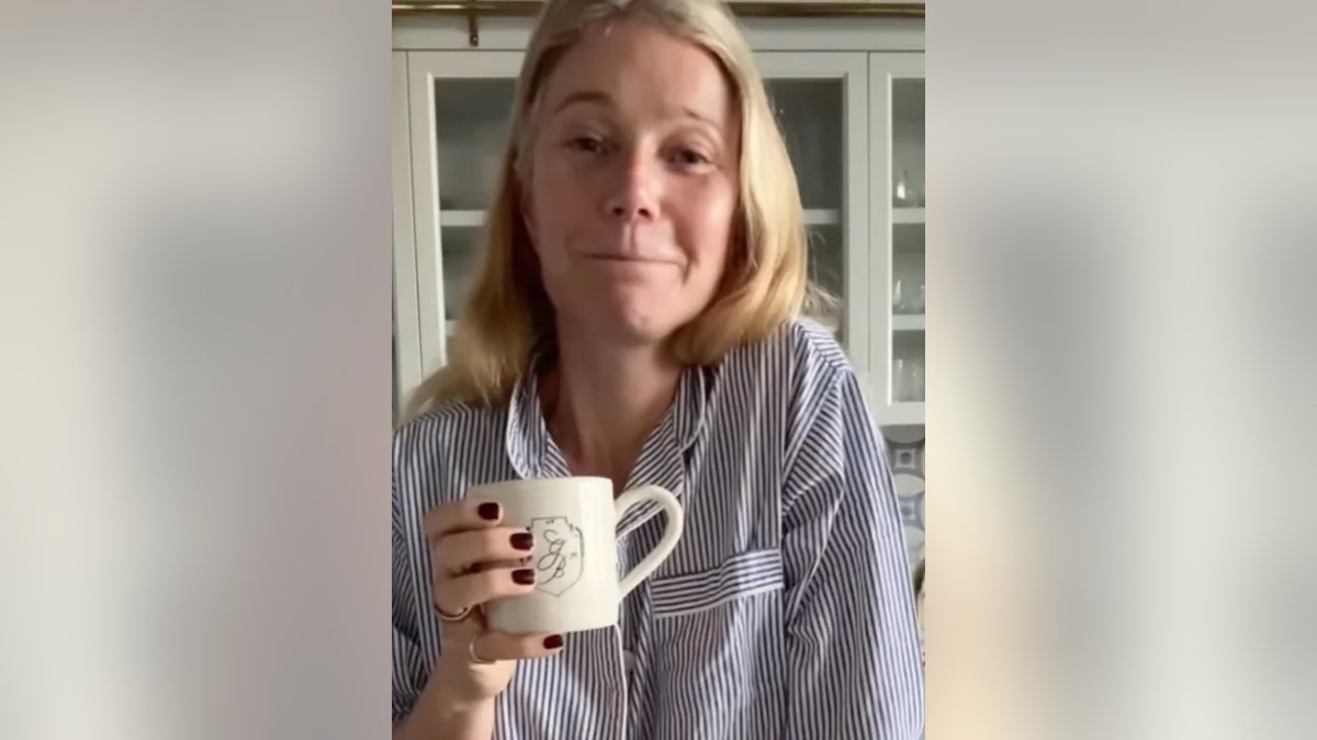 Gwyneth Paltrow holding a cup.