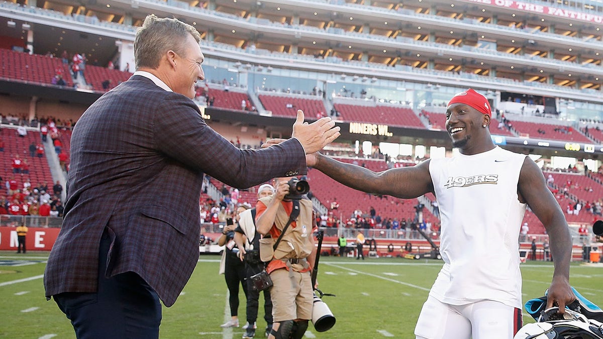 John Lynch greets Deebo Samuel