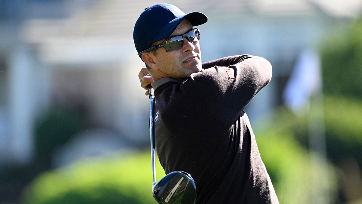 Adam Scott tees off