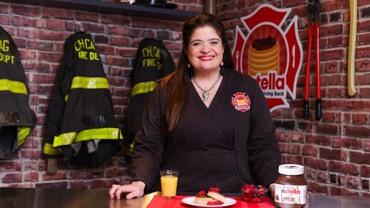 Alex Guarnaschelli poses for a photograph with Nutella hazelnut spread