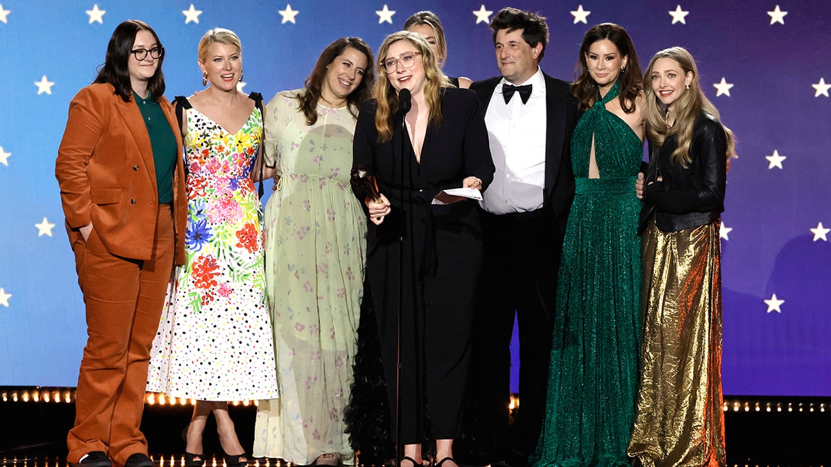 Liz Hannah, Victoria Thompson, Jordana Mollick, Elizabeth Meriwether, Michael Showalter, Rebecca Jarvis and Amanda Seyfried on stage at 2023 Critics Choice Awards