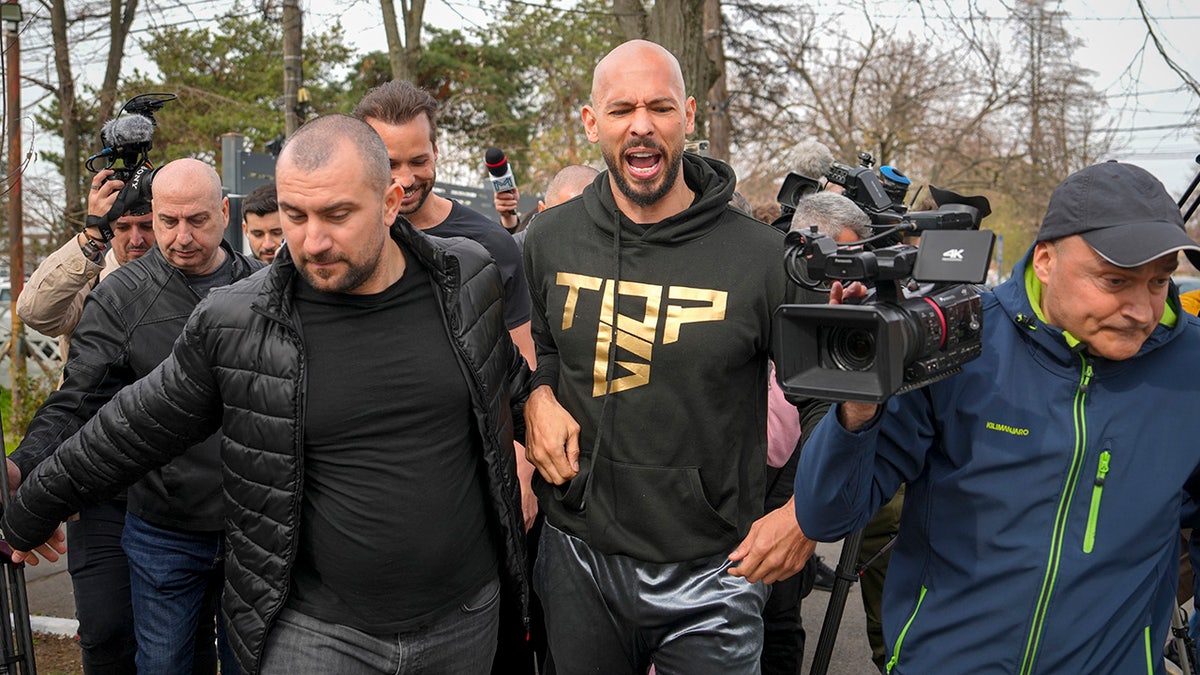 Andrew Tate and Tristan Tate check in at Romanian police station after departing Florida