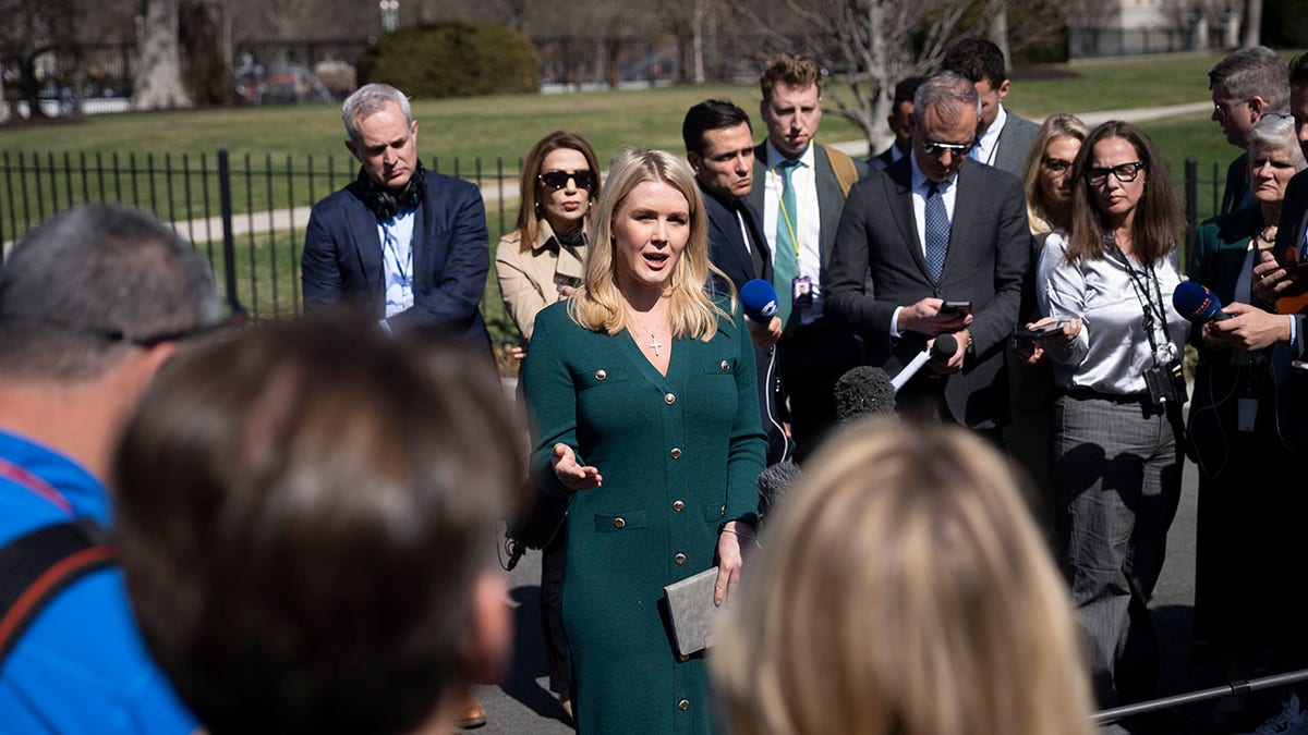 Journalists gathered around Livite outside the White House