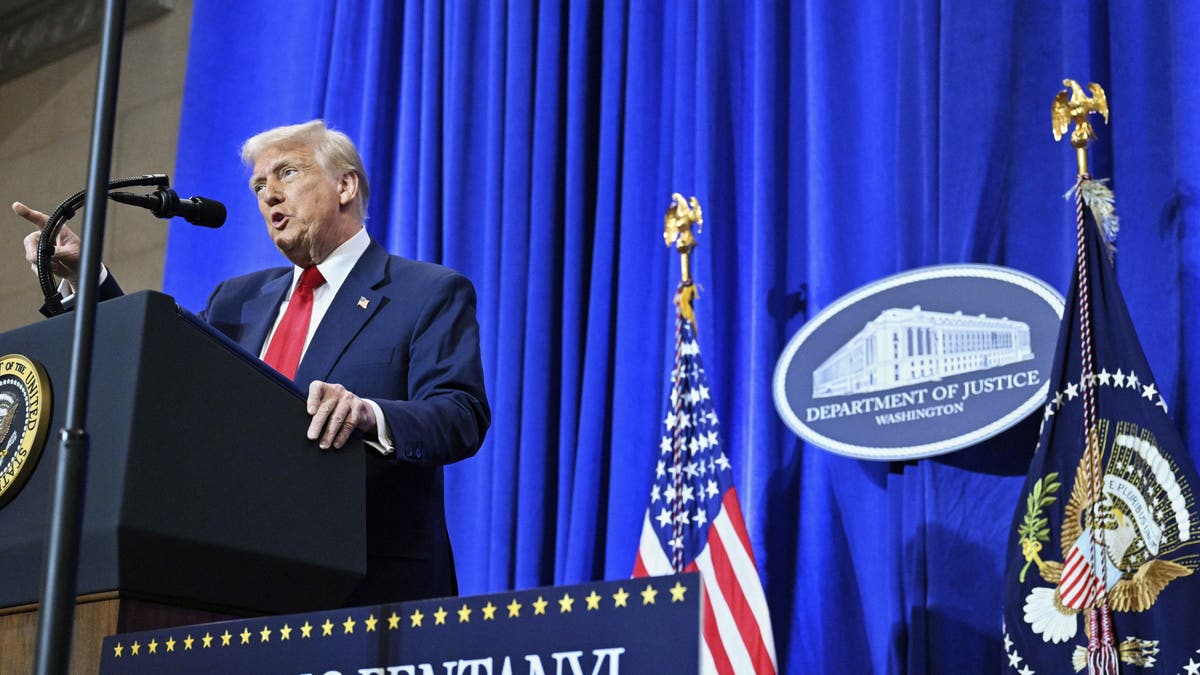 President Donald Trump speaks in the Department of Justice in Washington, on Friday, March 14, 2025. (Pool through AP)