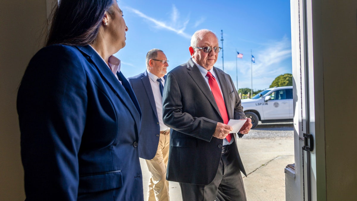 Darrel Vannoy, center, the warden of Louisiana State Penitentiary, walks into a room to announce that the execution of Jessie Hoffman Jr. is moving forward on Tuesday in Angola, La. Hoffman was convicted in the 1996 murder of Mary "Molly" Elliott.