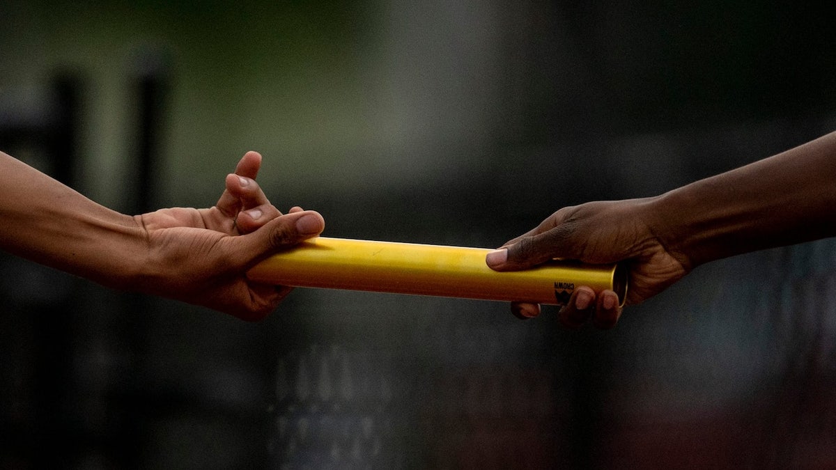 A stick is delivered in the relay race of 4x100 meters.