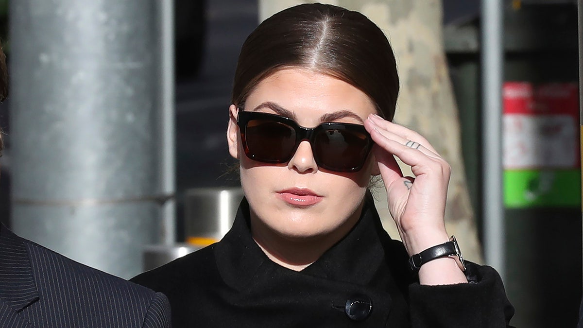 Belle Gibson arrives at court