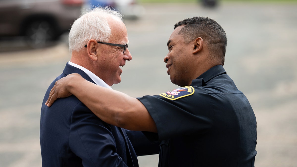 Minnesota Gov. Tim Walz greets Bloomington Police Chief Booker Hodges