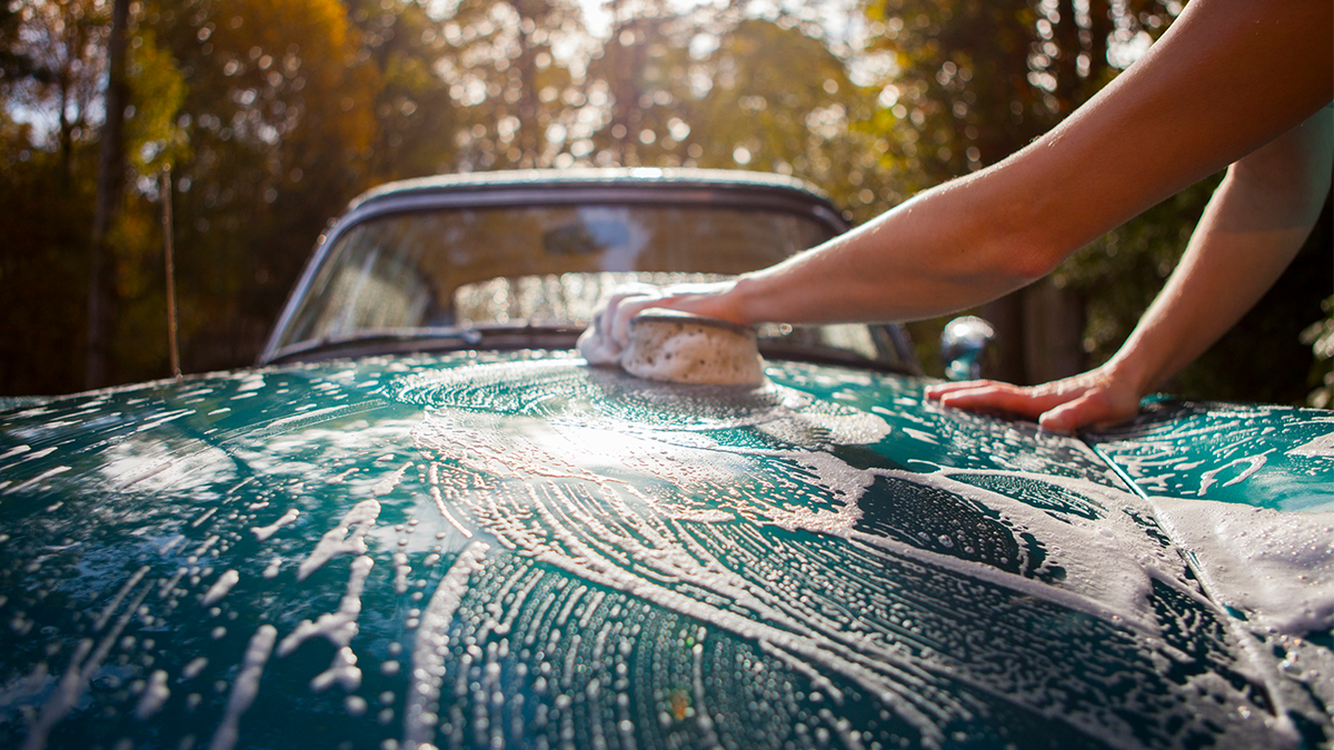 Woman washing the car