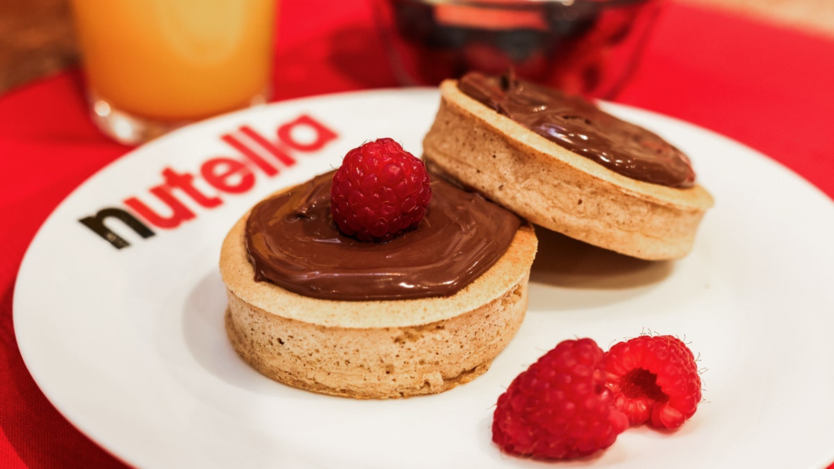 Nutella cinnamon cloud pancakes are shown on a plate.