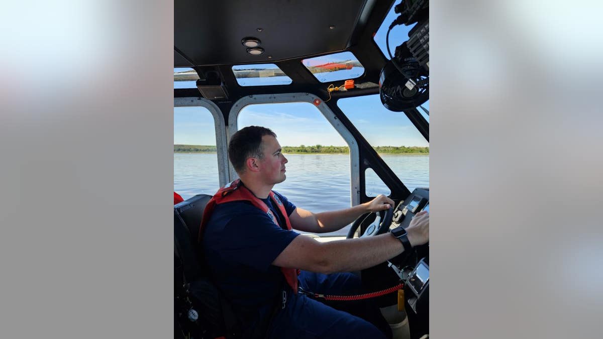 A member of the Coast Guard is experimenting with the rescue boat