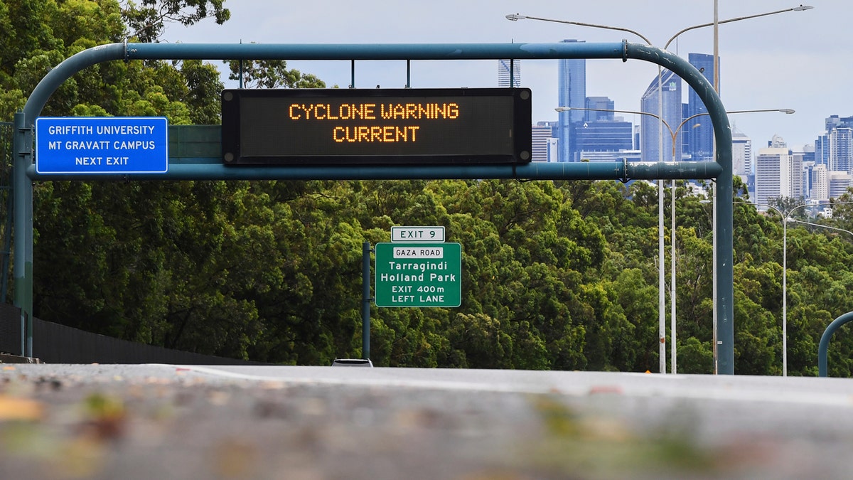 "CYCLONE WARNING CURRENT" sign