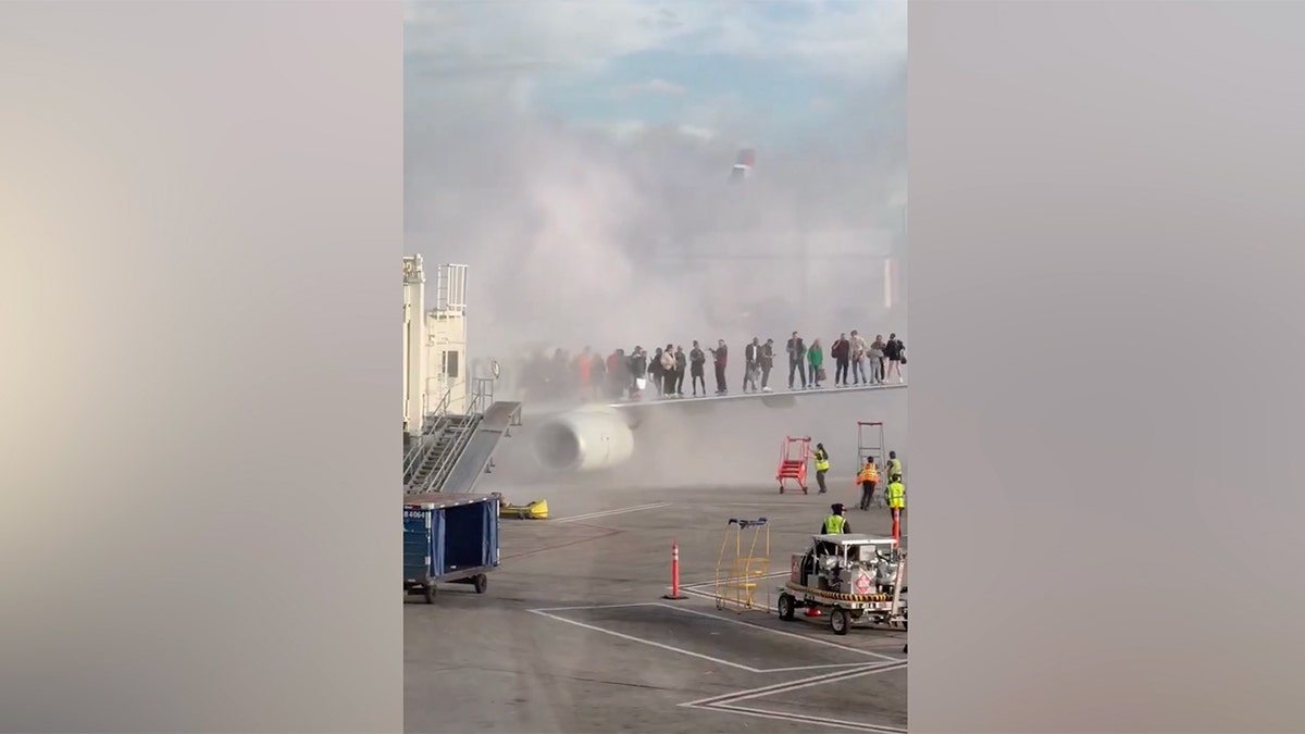 The American Airlines plane sets on fire at Denver International Airport.