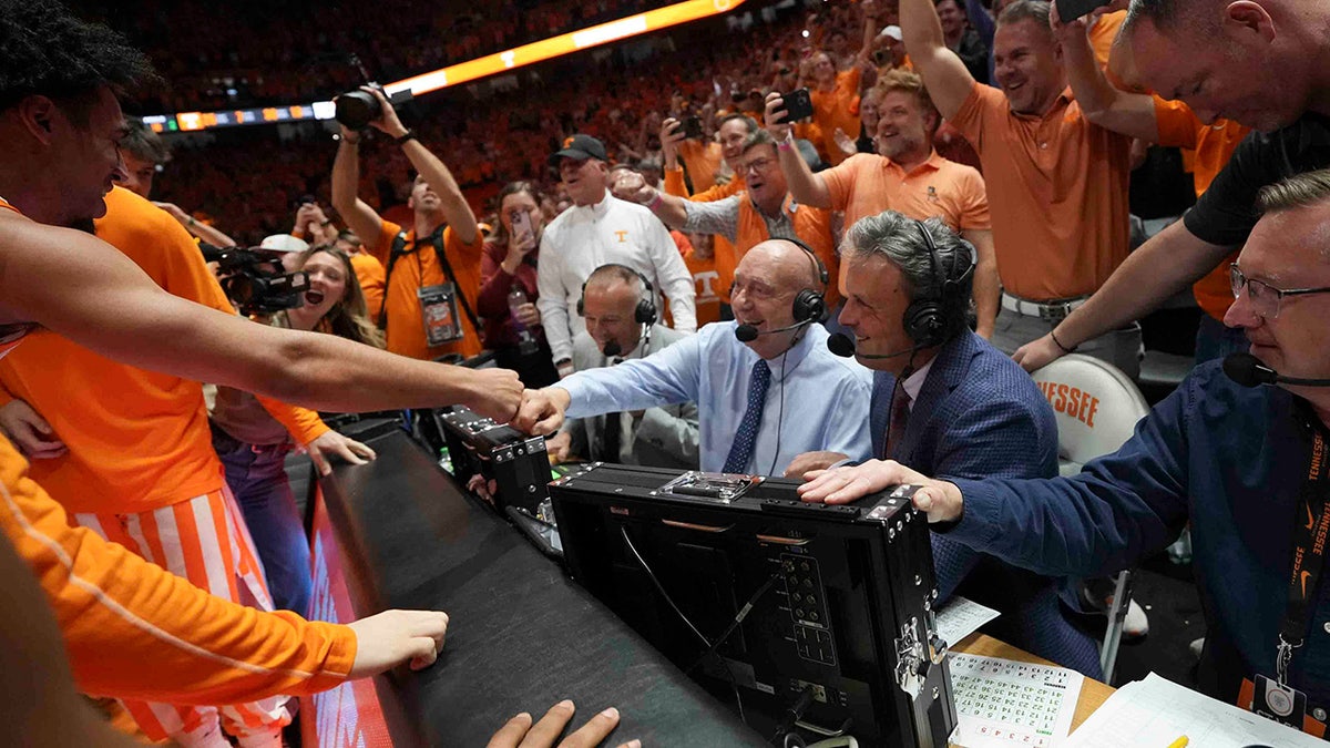 Tennessee players celebrate with Dick Vitaly