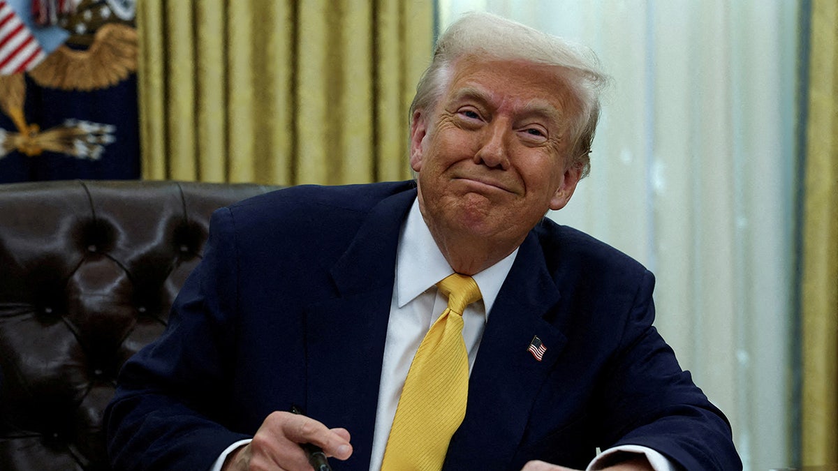 Donald Trump sits in the Oval Office in Washington, DC