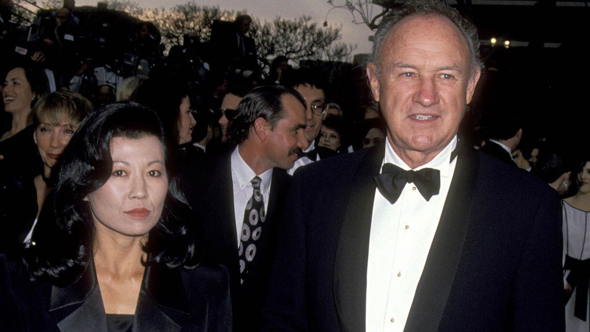 Betsy Nakawa Hackman and Gene Hackman in the Award Acharge