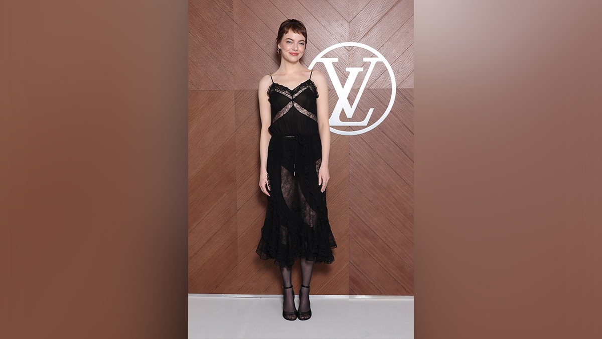 Emma Stone wore a lace-clear black dress at the Louis Vuitton fashion show in Paris. 