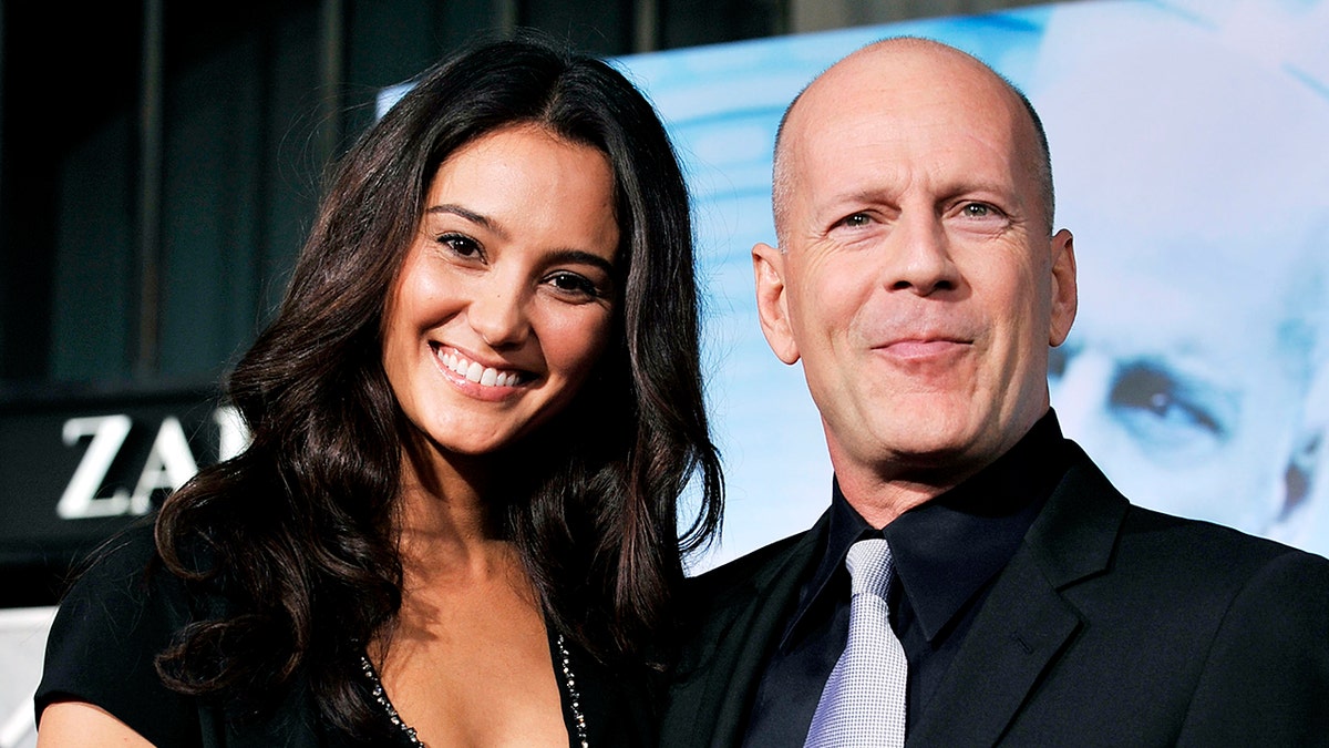 Emma Heming Willis posing with Bruce Willis